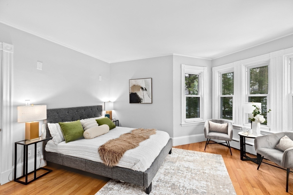 90 Brook Street Wellesley, MA 02482 - Photo 22 of 40 a bedroom with a bed and wooden floor