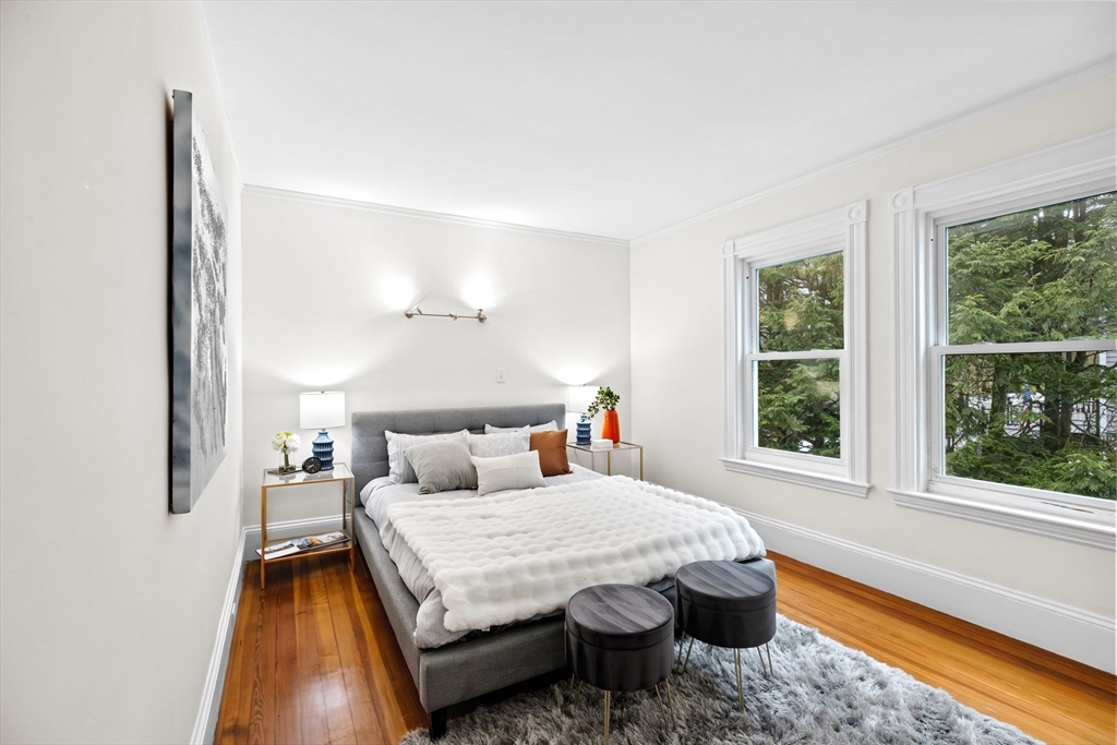 90 Brook Street Wellesley, MA 02482 - Photo 24 of 40 a bedroom with a bed and a large window
