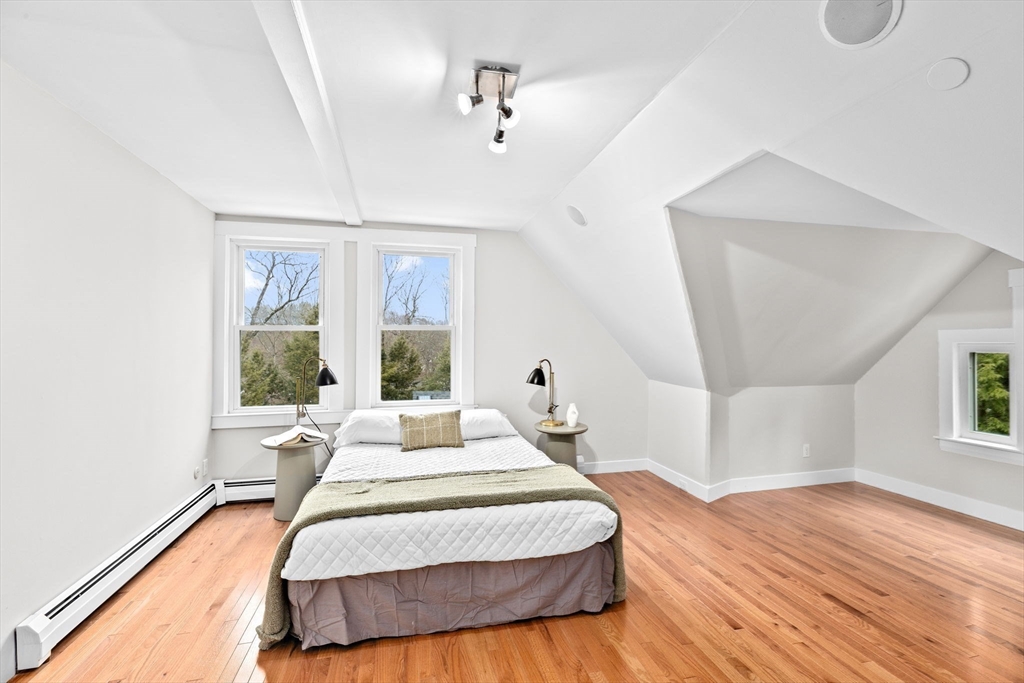 90 Brook Street Wellesley, MA 02482 - Photo 29 of 40 a spacious bedroom with a bed and a large window