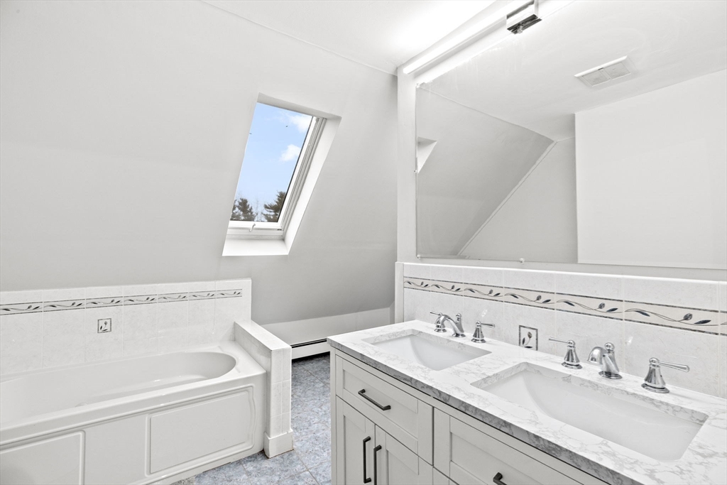 90 Brook Street Wellesley, MA 02482 - Photo 31 of 40 a view of bathroom with a sink and a mirror