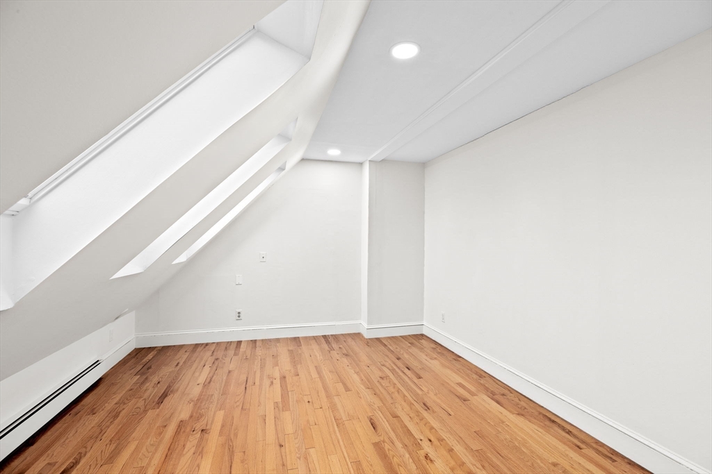 90 Brook Street Wellesley, MA 02482 - Photo 33 of 40 a view of empty room with wooden floor