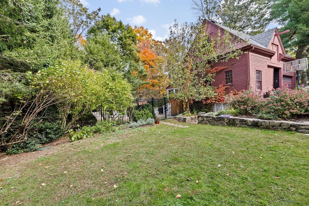 90 Brook Street Wellesley, MA 02482 - Photo 39 of 40 a view of a house with a yard and sitting area
