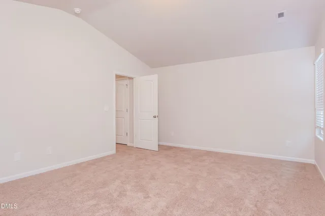 a bathroom with a sink toilet and window