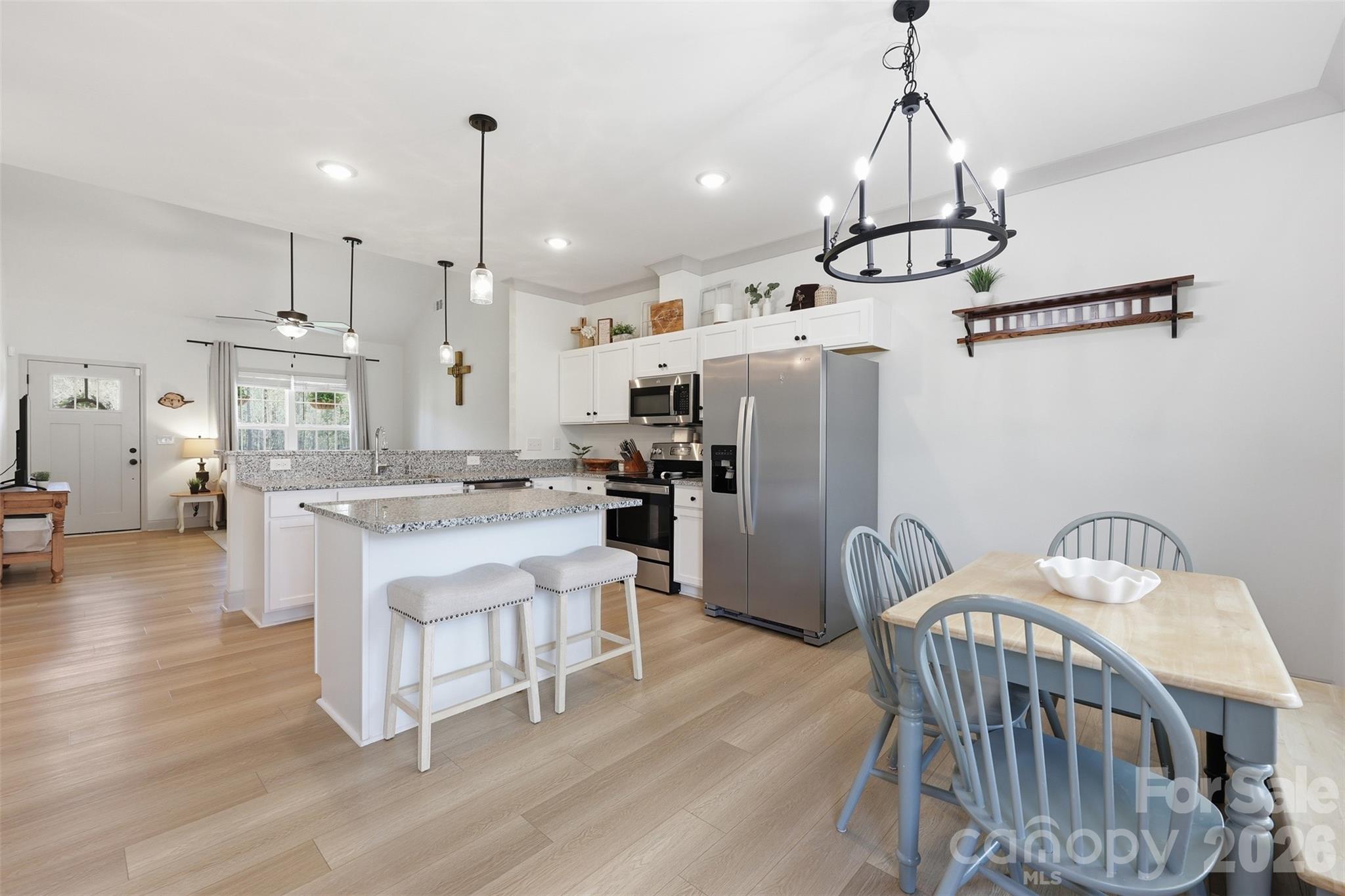 2909 Good Road Clover, SC 29710 - Photo 14 of 37 a kitchen with sink a refrigerator and chairs
