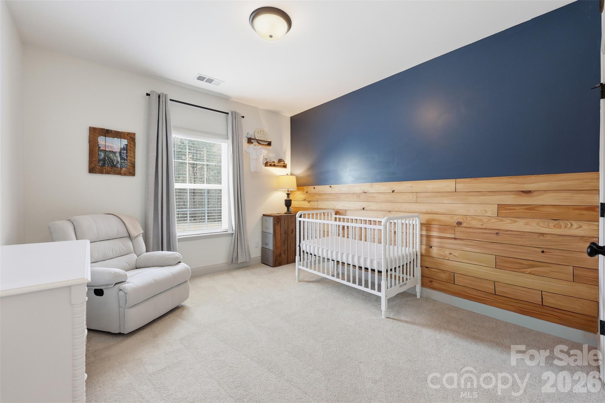 2909 Good Road Clover, SC 29710 - Photo 19 of 37 a bedroom with furniture and baby bed