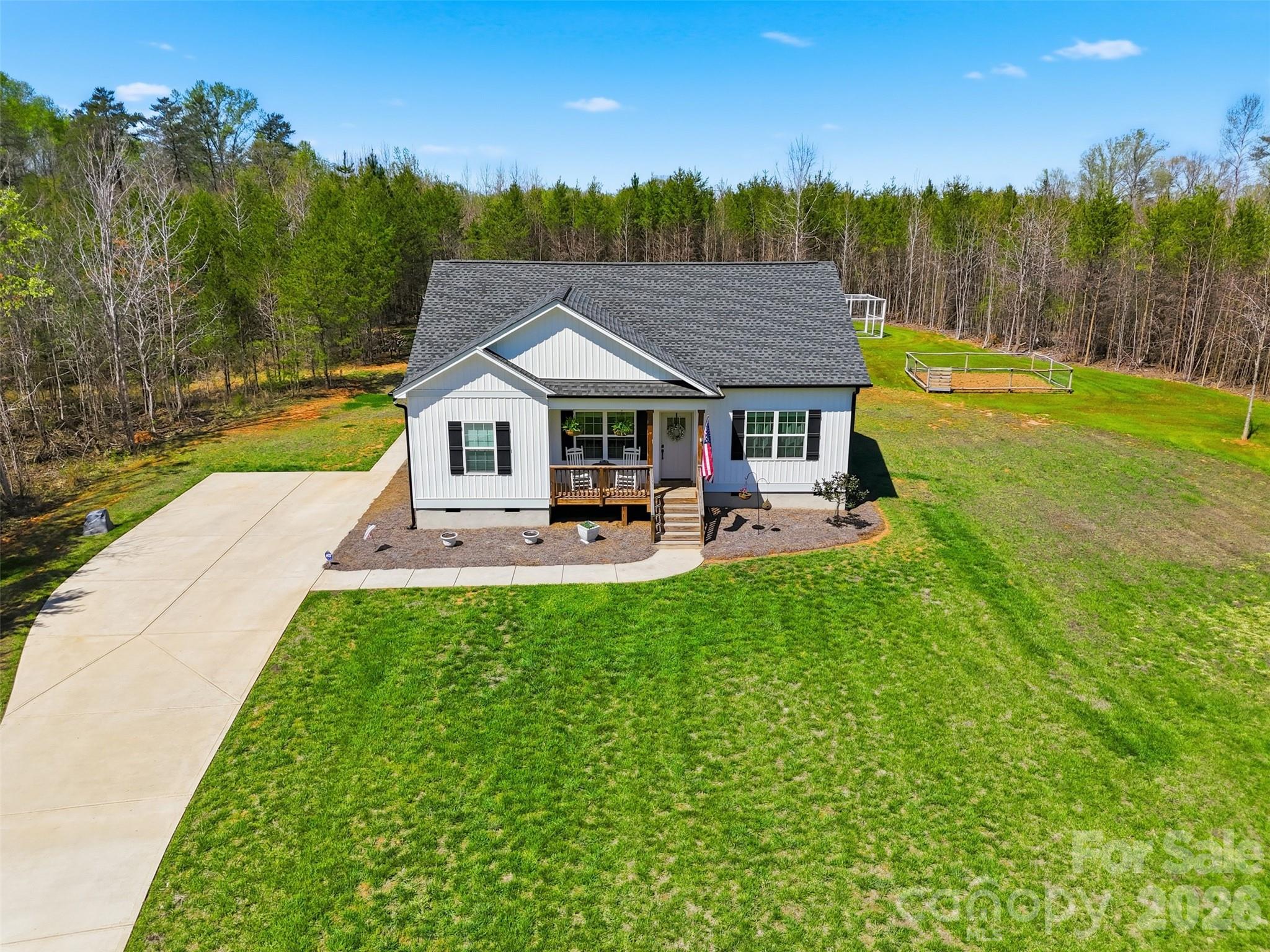 2909 Good Road Clover, SC 29710 - Photo 33 of 37 a view of a patio with table and chairs with wooden floor and fence