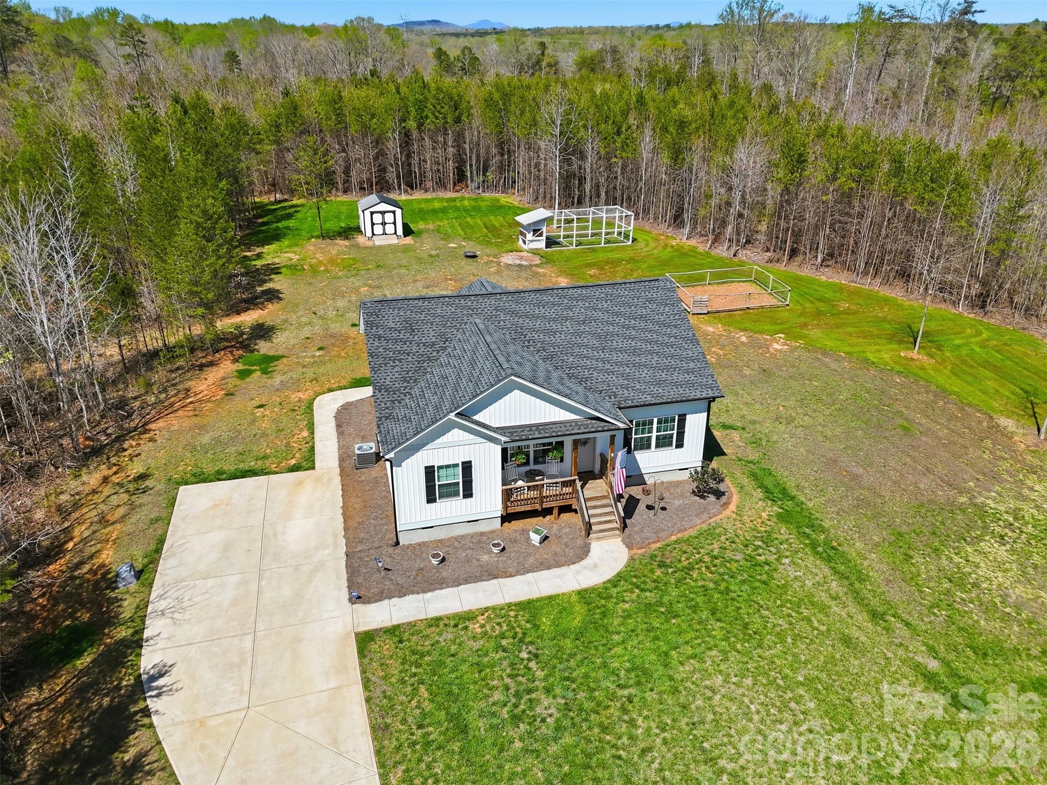 2909 Good Road Clover, SC 29710 - Photo 34 of 37 a view of a patio with table and chairs potted plants with wooden floor