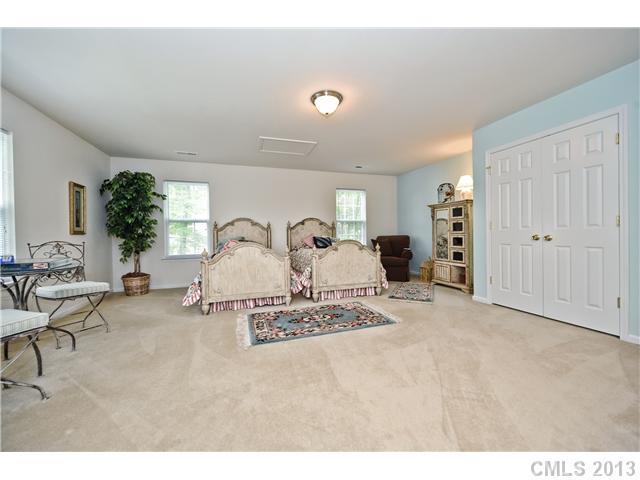 404 Morningside Road Charlotte, NC 28214 - Photo 12 of 14 a view of a livingroom with furniture and a flat screen tv