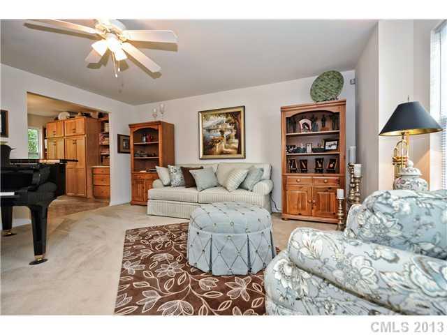 404 Morningside Road Charlotte, NC 28214 - Photo 4 of 14 a living room with furniture and a chandelier