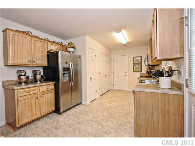 404 Morningside Road Charlotte, NC 28214 - Photo 7 of 14 a kitchen with stainless steel appliances a refrigerator and a stove