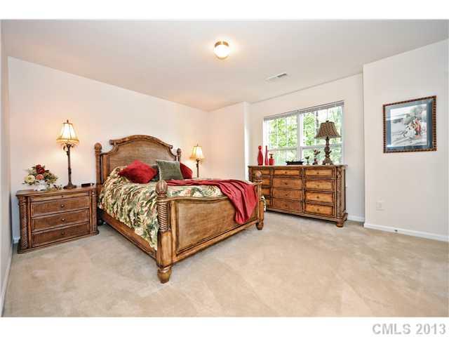 404 Morningside Road Charlotte, NC 28214 - Photo 8 of 14 a bedroom with a bed and a window