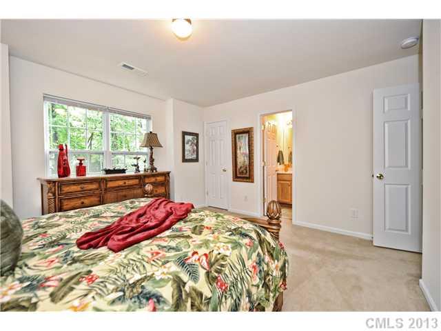 404 Morningside Road Charlotte, NC 28214 - Photo 9 of 14 a bedroom with a bed and a dresser