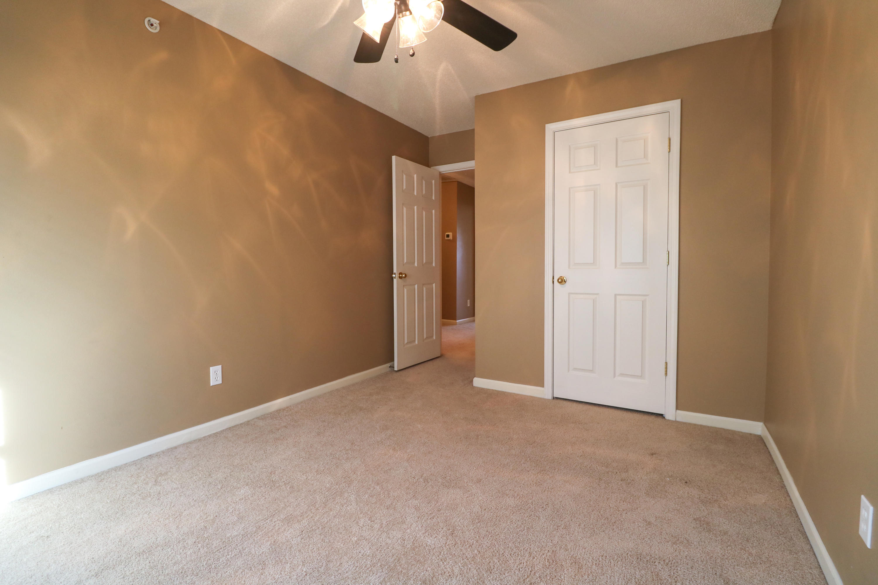 406 Crooked Pine Trail Crestview, FL 32539 - Photo 15 of 22 an empty room with closet and a chandelier fan