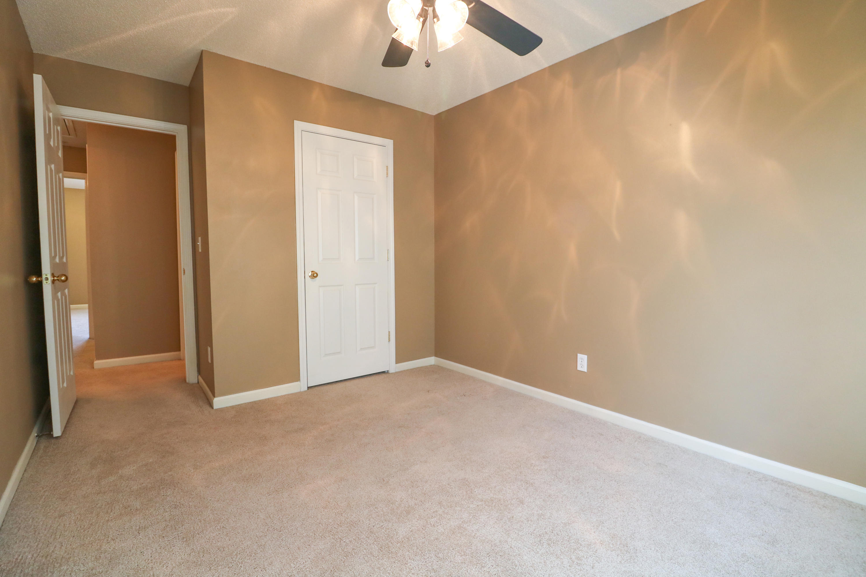 406 Crooked Pine Trail Crestview, FL 32539 - Photo 16 of 22 a view of an empty room and chandelier fan