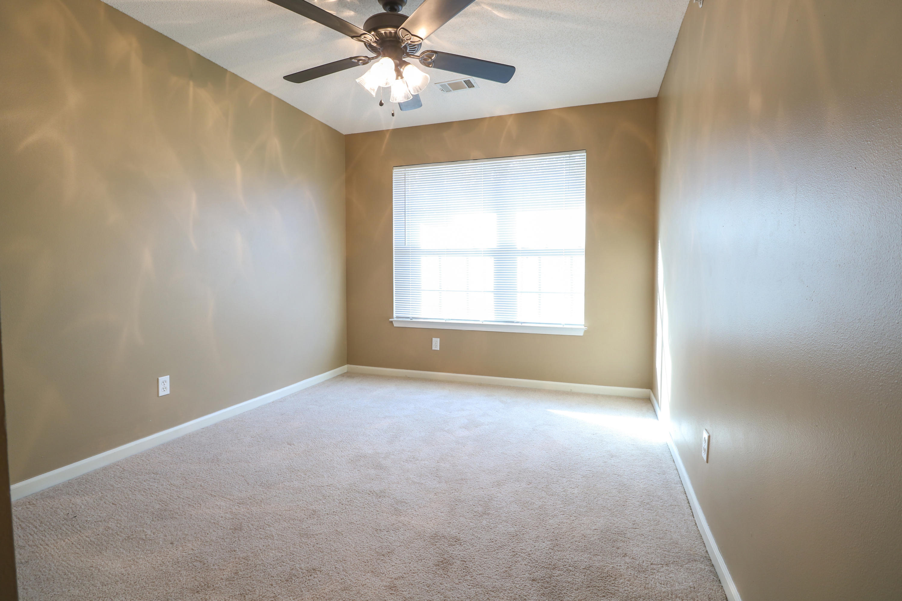 406 Crooked Pine Trail Crestview, FL 32539 - Photo 18 of 22 an empty room with a window and a fan