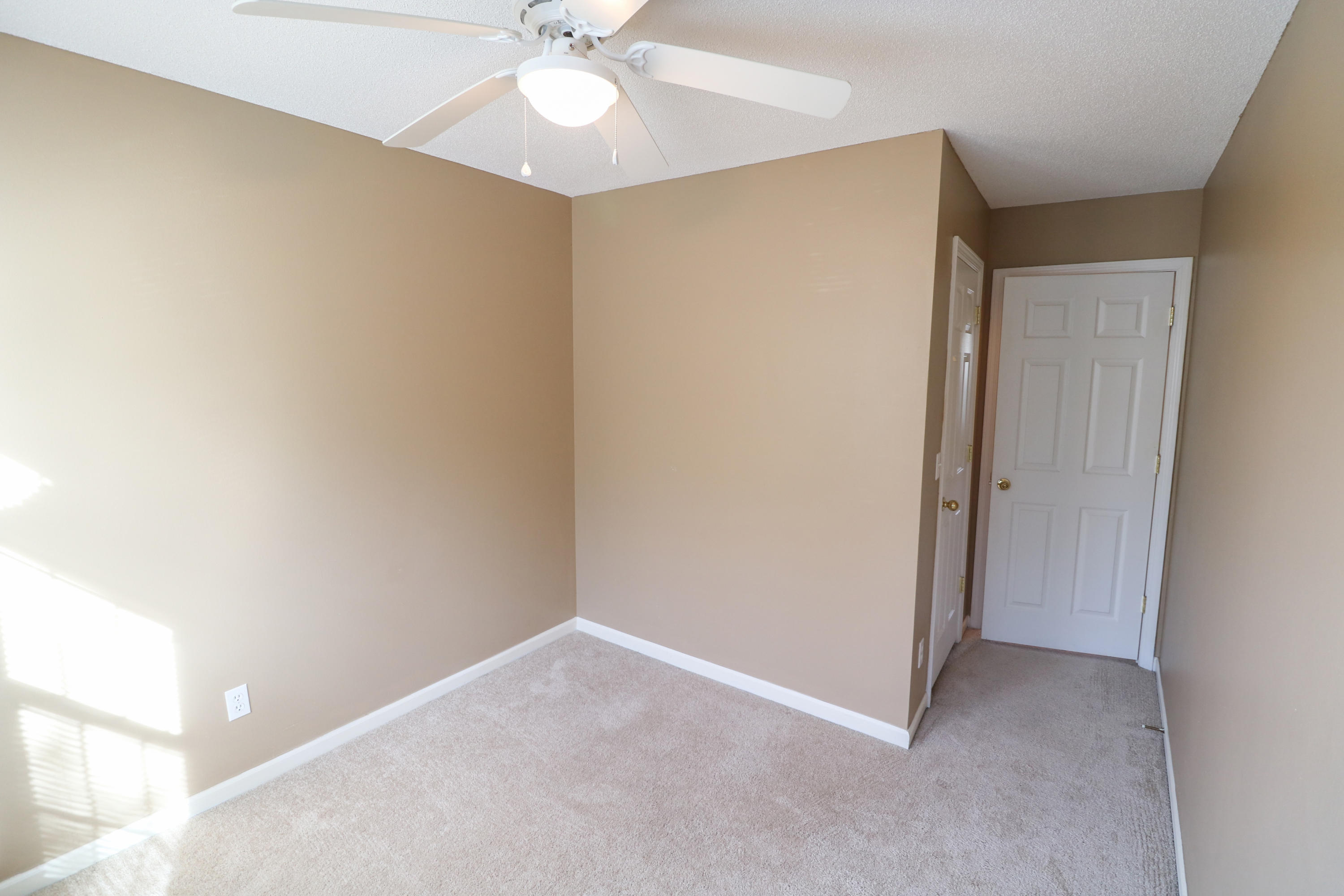 406 Crooked Pine Trail Crestview, FL 32539 - Photo 19 of 22 an empty room with a fan and a fan