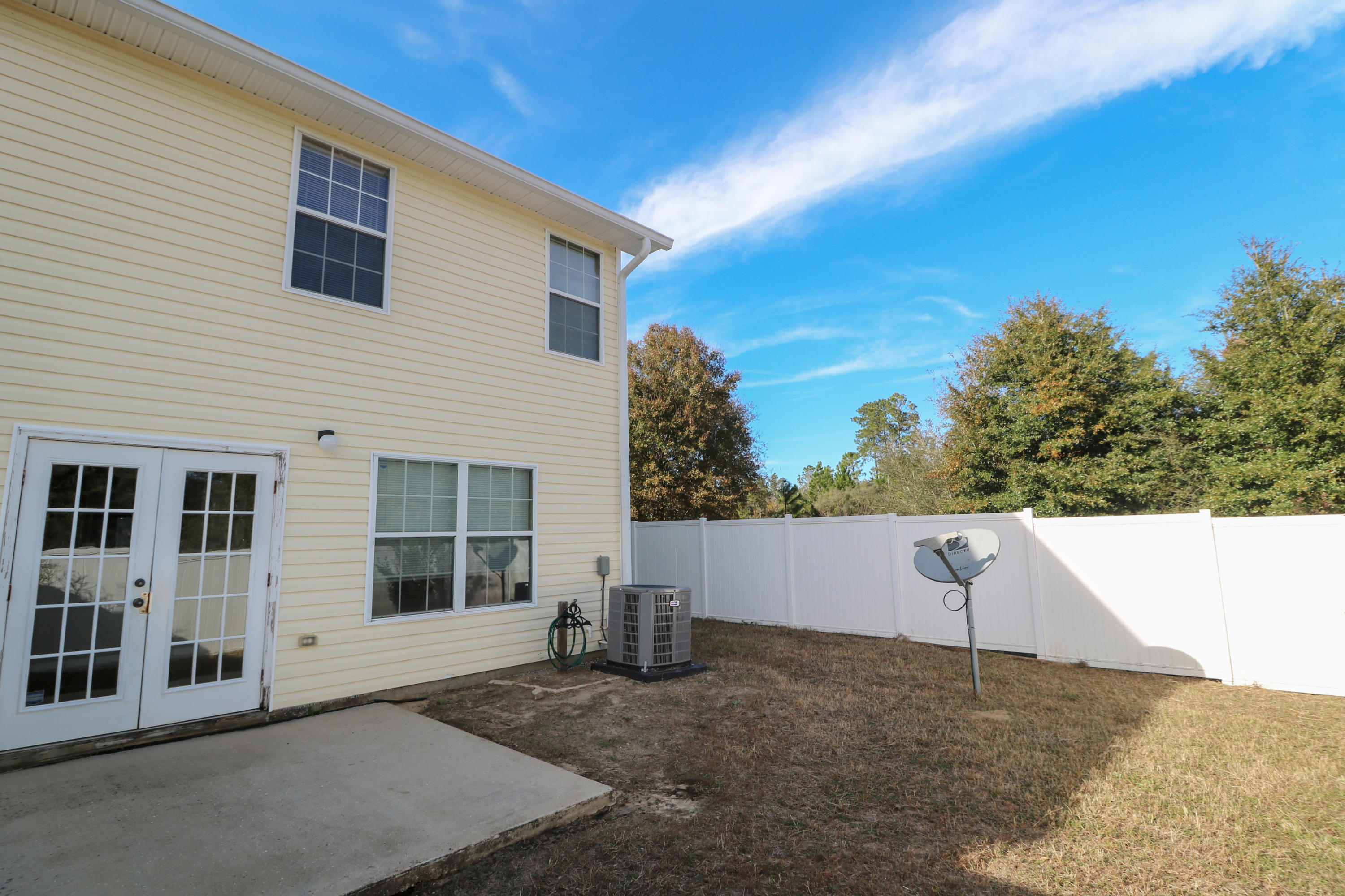 406 Crooked Pine Trail Crestview, FL 32539 - Photo 22 of 22 a view of a house with a backyard