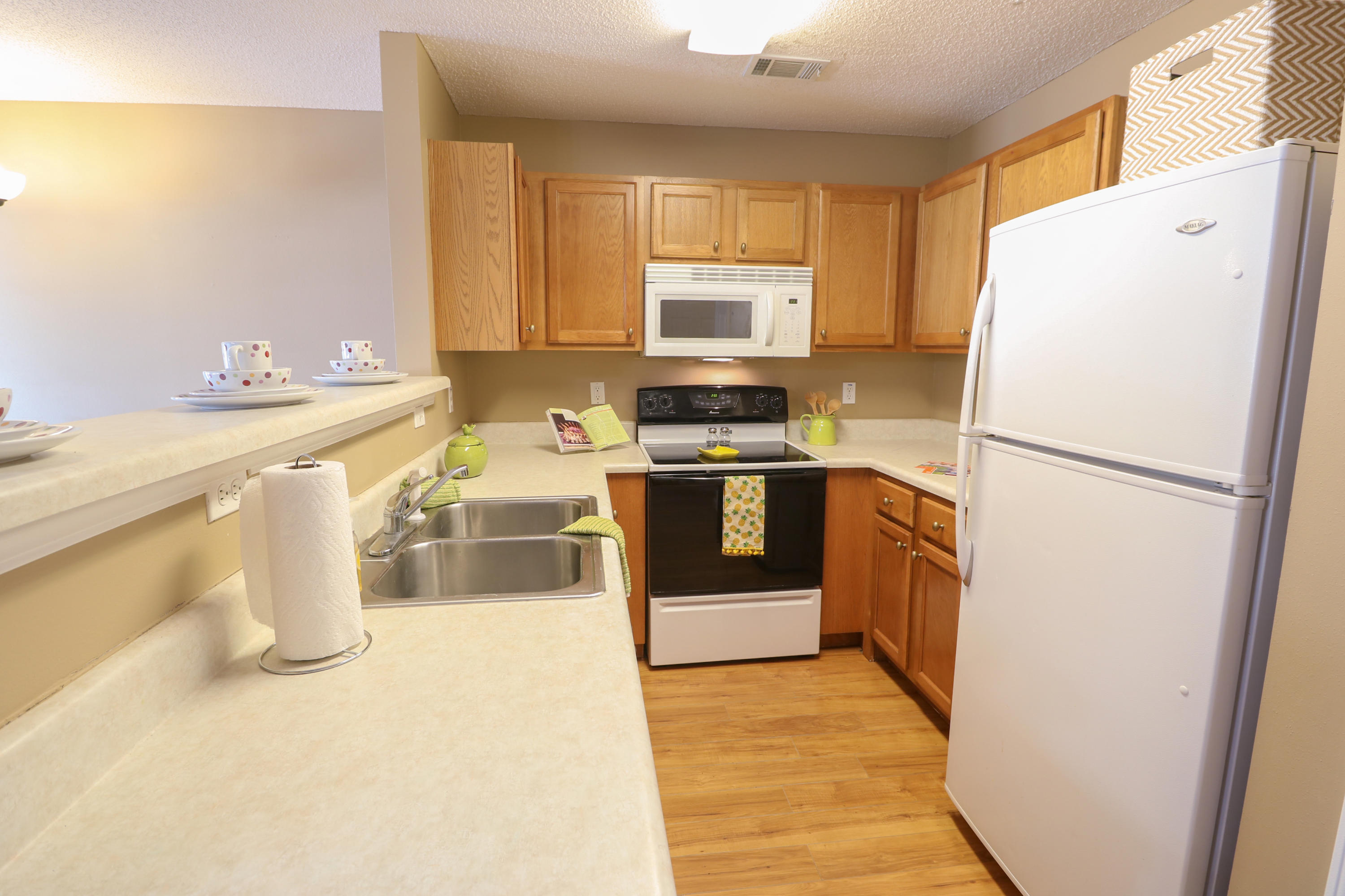 406 Crooked Pine Trail Crestview, FL 32539 - Photo 7 of 22 a kitchen with a refrigerator a stove a sink dishwasher and a refrigerator