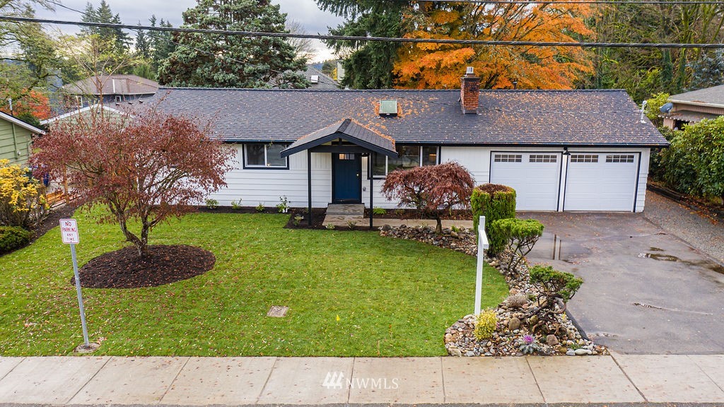 100 234th Place Southwest Bothell, WA 98021 - Photo 3 of 31 a front view of a house with garden