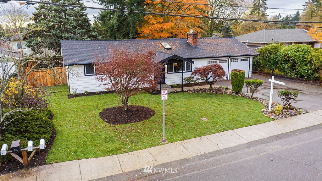 100 234th Place Southwest Bothell, WA 98021 - Photo 22 of 31 a front view of a house with a yard