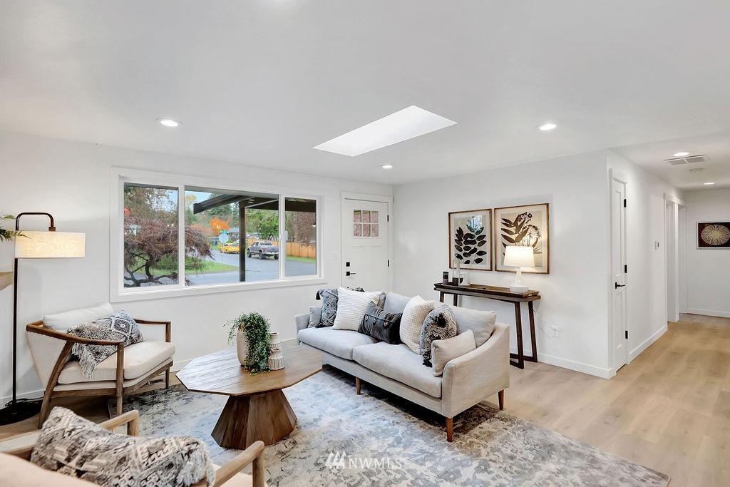 100 234th Place Southwest Bothell, WA 98021 - Photo 6 of 31 a living room with furniture and a large window