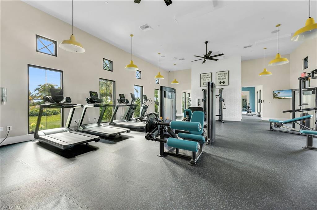 3993 Perseus Street Naples, FL 34120 - Photo 17 of 20 Gym featuring a towering ceiling and a ceiling fan