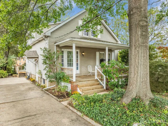 front view of a house with a small yard