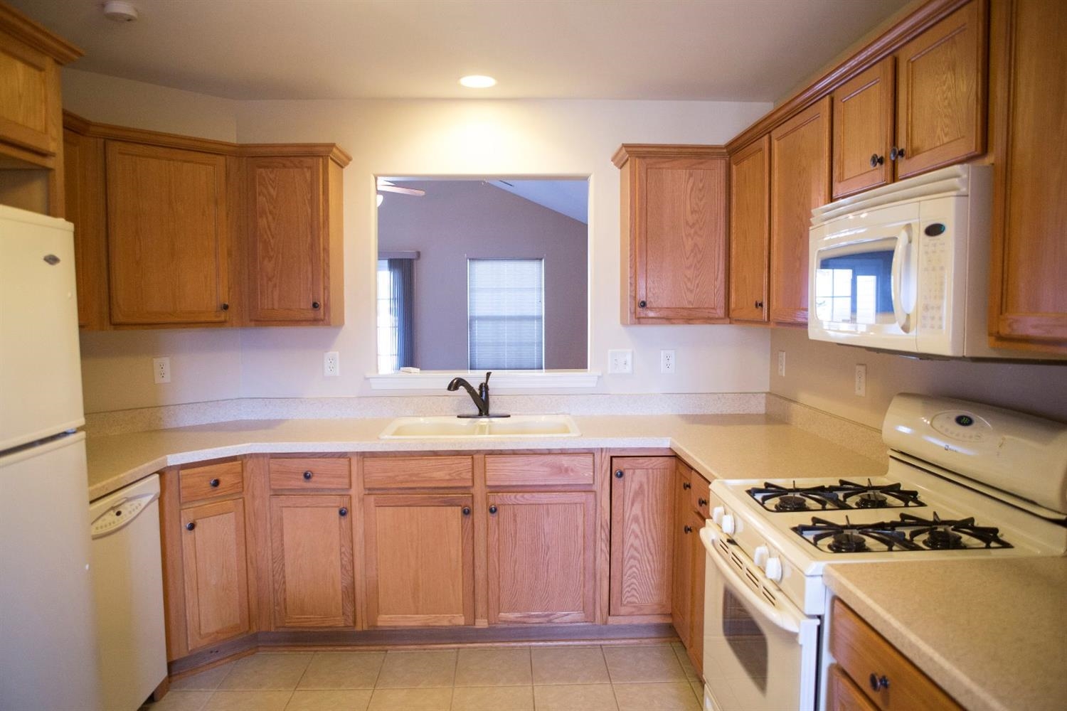 10669 Keystone Lane Crown Point, IN 46307 - Photo 8 of 10 a kitchen with cabinets appliances a sink and a stove