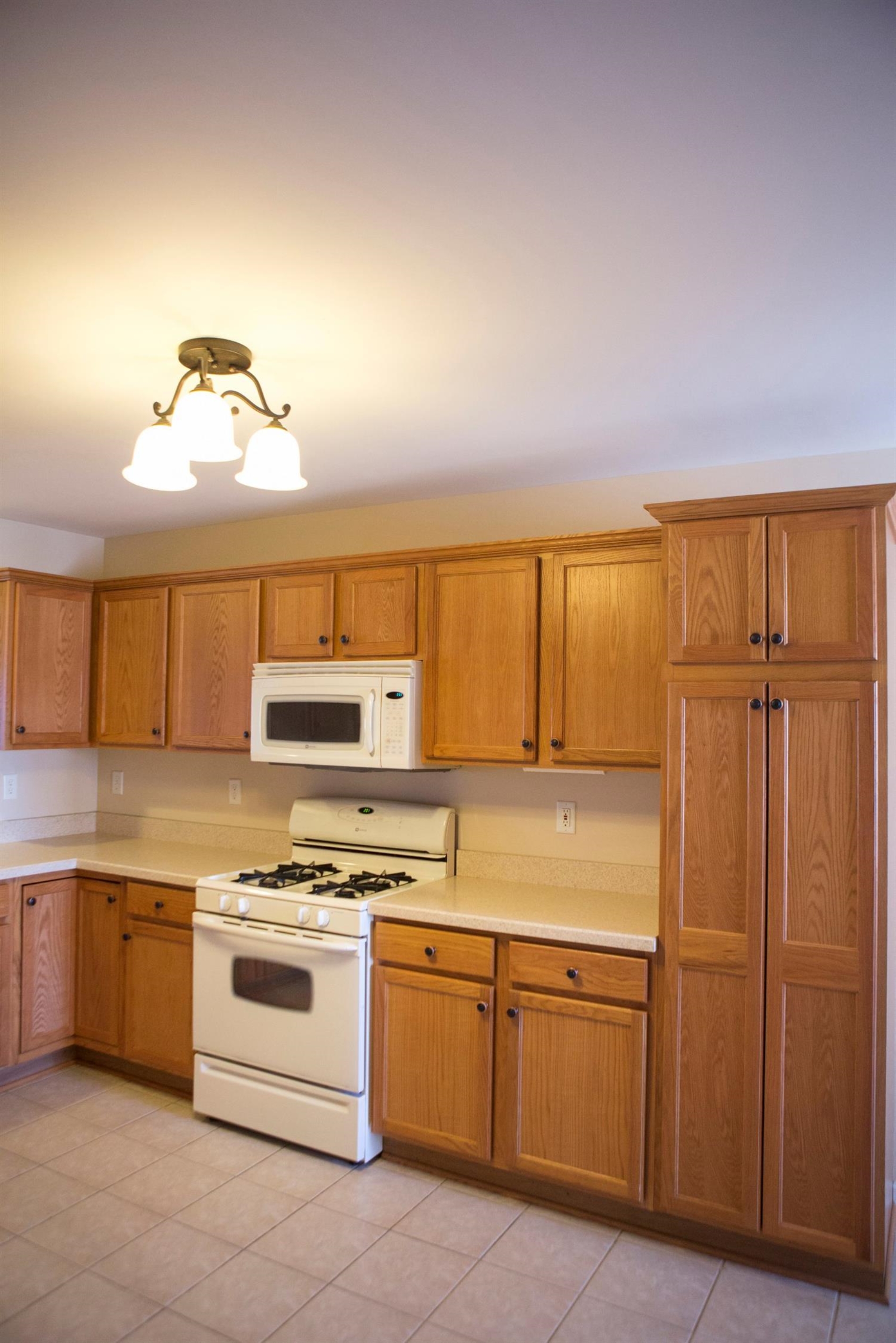 10669 Keystone Lane Crown Point, IN 46307 - Photo 10 of 10 a kitchen with granite countertop a sink cabinets and stainless steel appliances