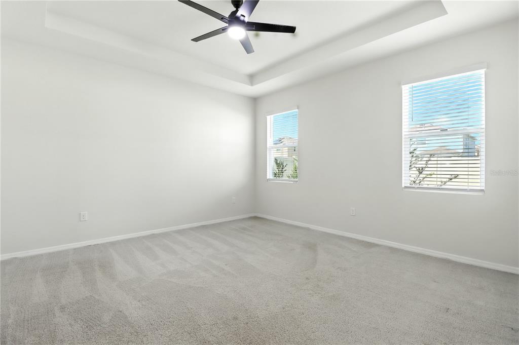 8931 Southwest 49th Circle Ocala, FL 34476 - Photo 16 of 42 an empty room with a window and a fan