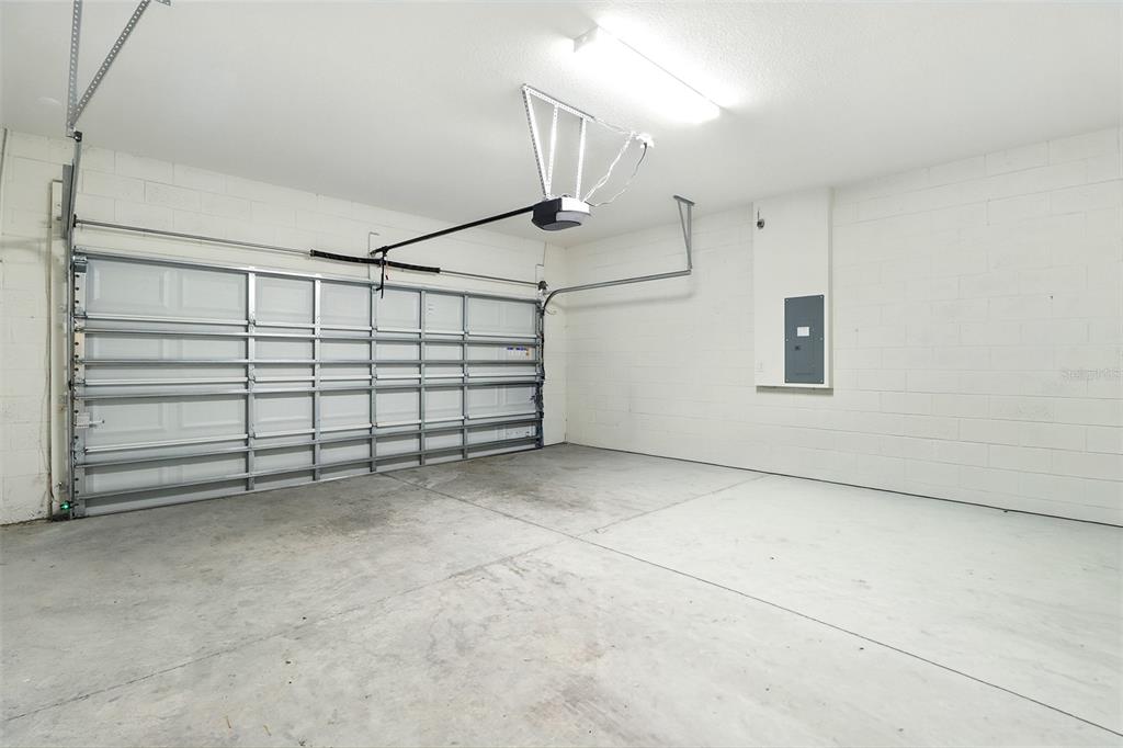 8931 Southwest 49th Circle Ocala, FL 34476 - Photo 19 of 42 a view of a garage with stairs