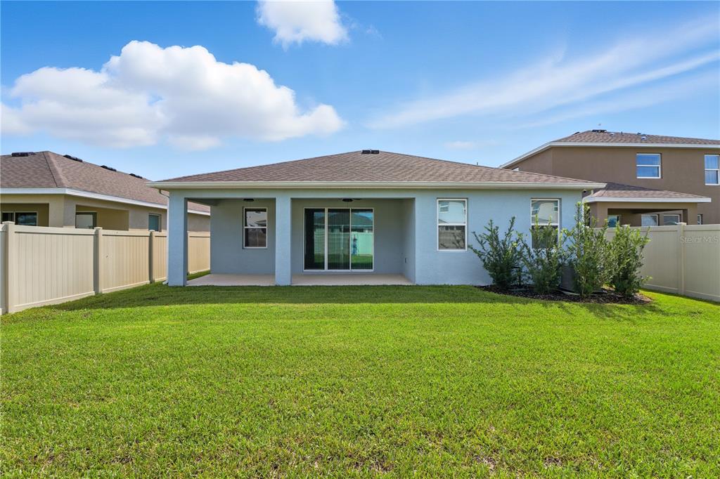8931 Southwest 49th Circle Ocala, FL 34476 - Photo 22 of 42 a view of a house with a garden