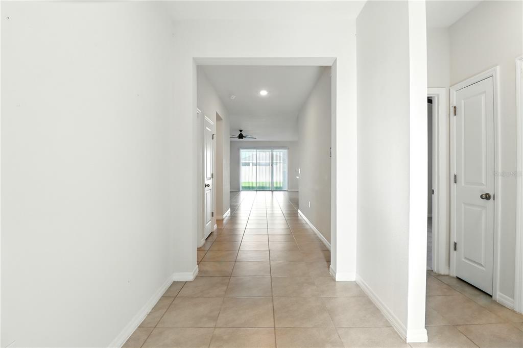 8931 Southwest 49th Circle Ocala, FL 34476 - Photo 24 of 42 a view of a hallway with wooden floor