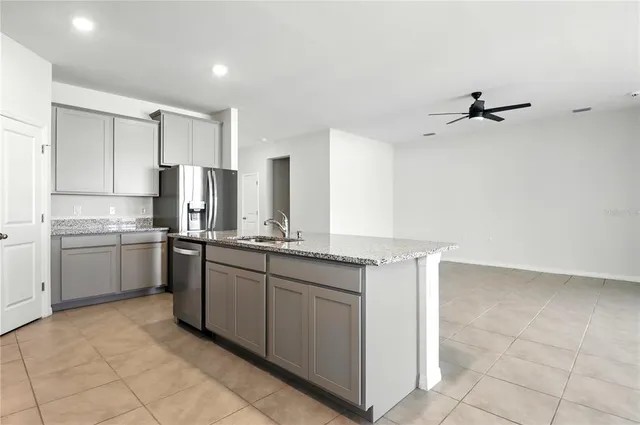 a stove top oven sitting inside of a kitchen