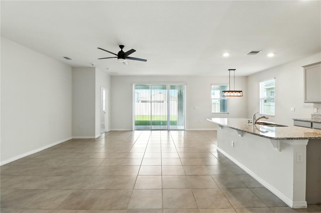 8931 Southwest 49th Circle Ocala, FL 34476 - Photo 4 of 42 a view of a kitchen with a sink and a window