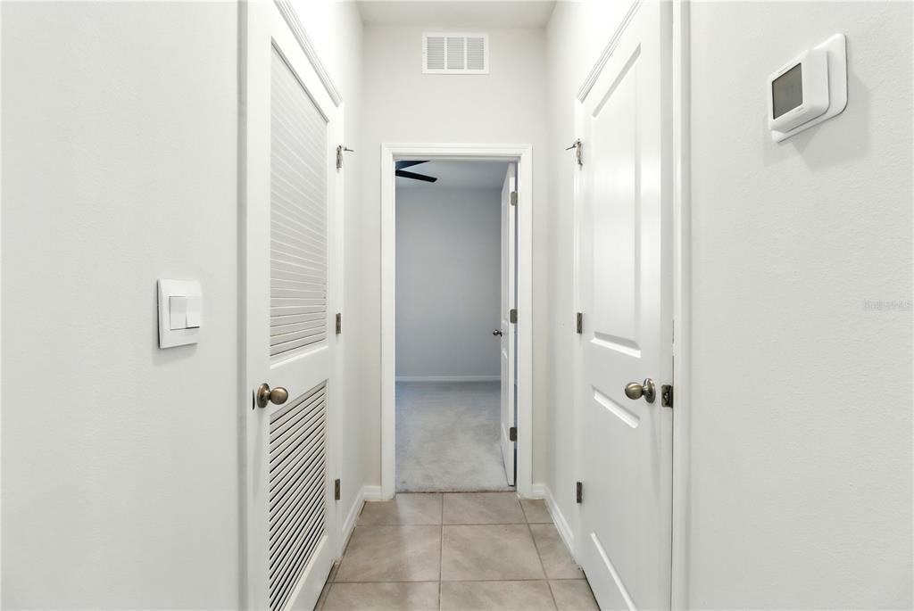 8931 Southwest 49th Circle Ocala, FL 34476 - Photo 8 of 42 a view of a bathroom from the hallway