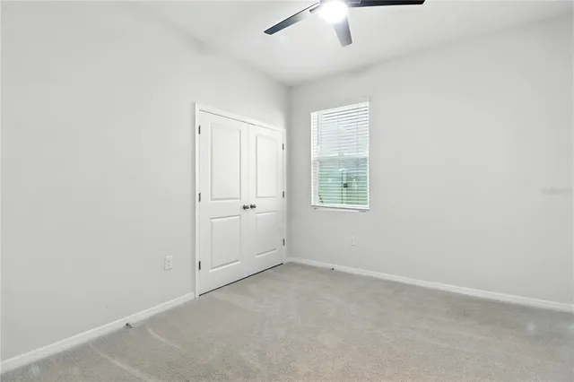 an empty room with fan