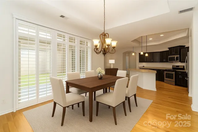 a spacious bedroom with a large bed and a large window