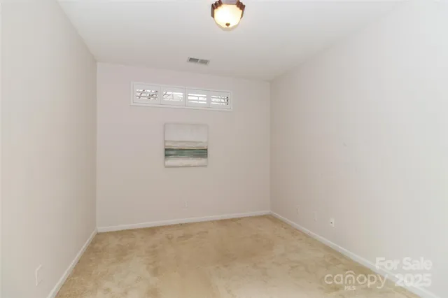 a kitchen with stainless steel appliances granite countertop a refrigerator and a stove