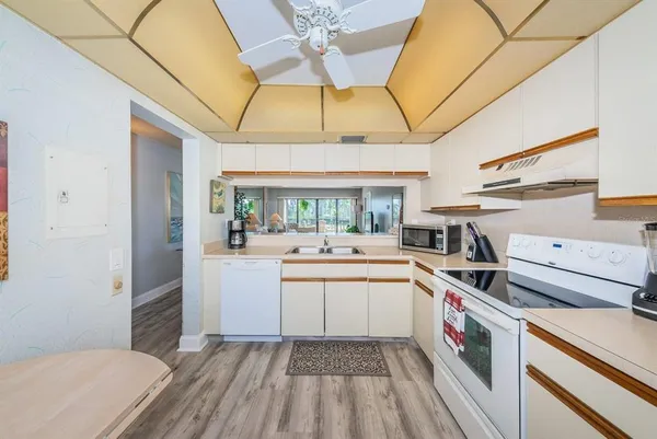 a kitchen with a sink and cabinets