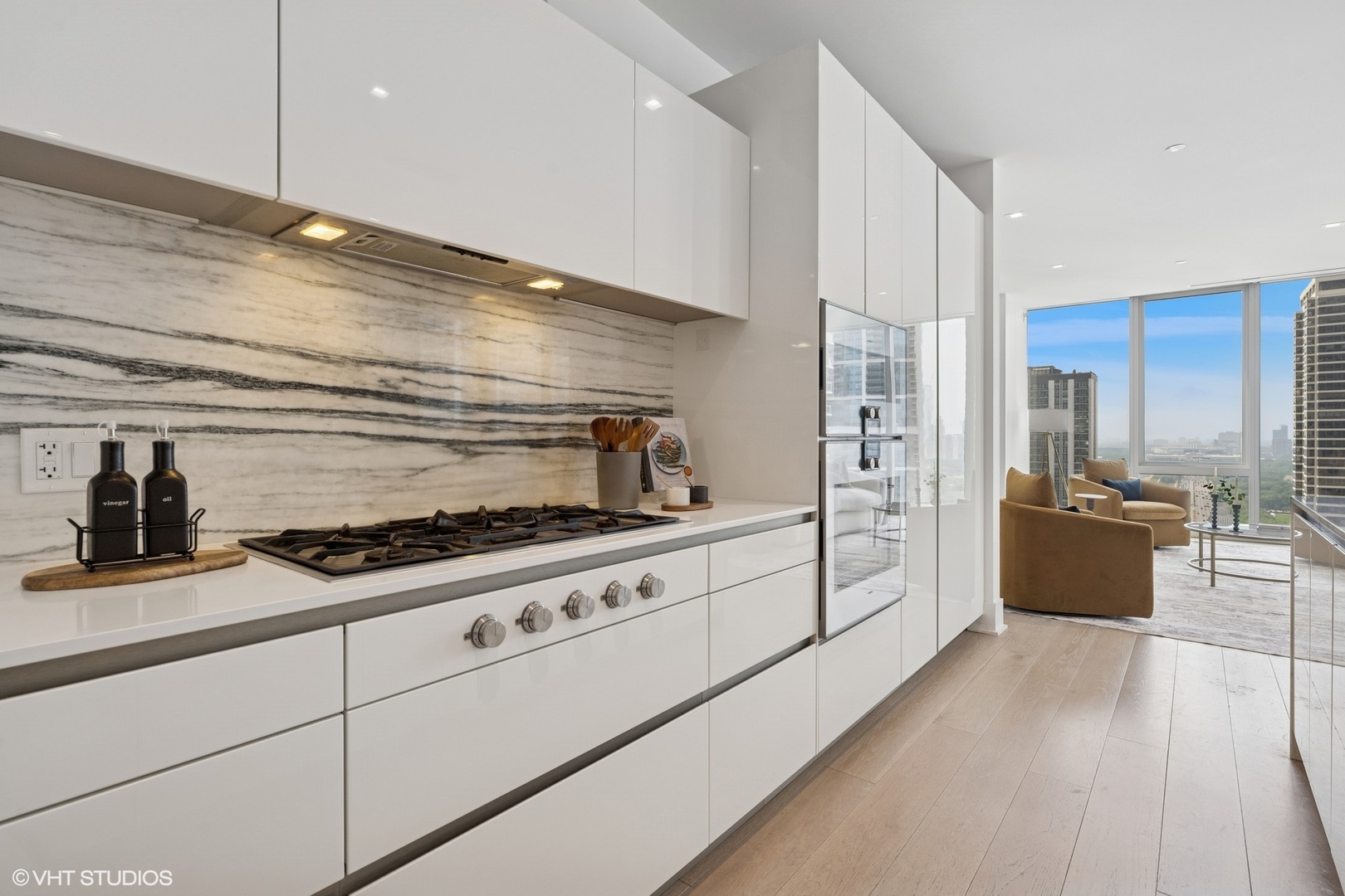363 East Wacker Drive, Unit 1903 Chicago, IL 60601 - Photo 7 of 39 a kitchen with stainless steel appliances granite countertop a stove and a refrigerator