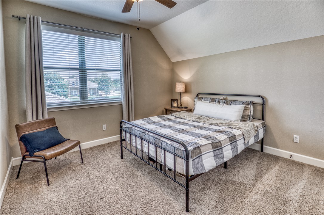 586 Ruby Drive Bellville, TX 77418 - Photo 23 of 50 a bedroom with a bed chair and a window