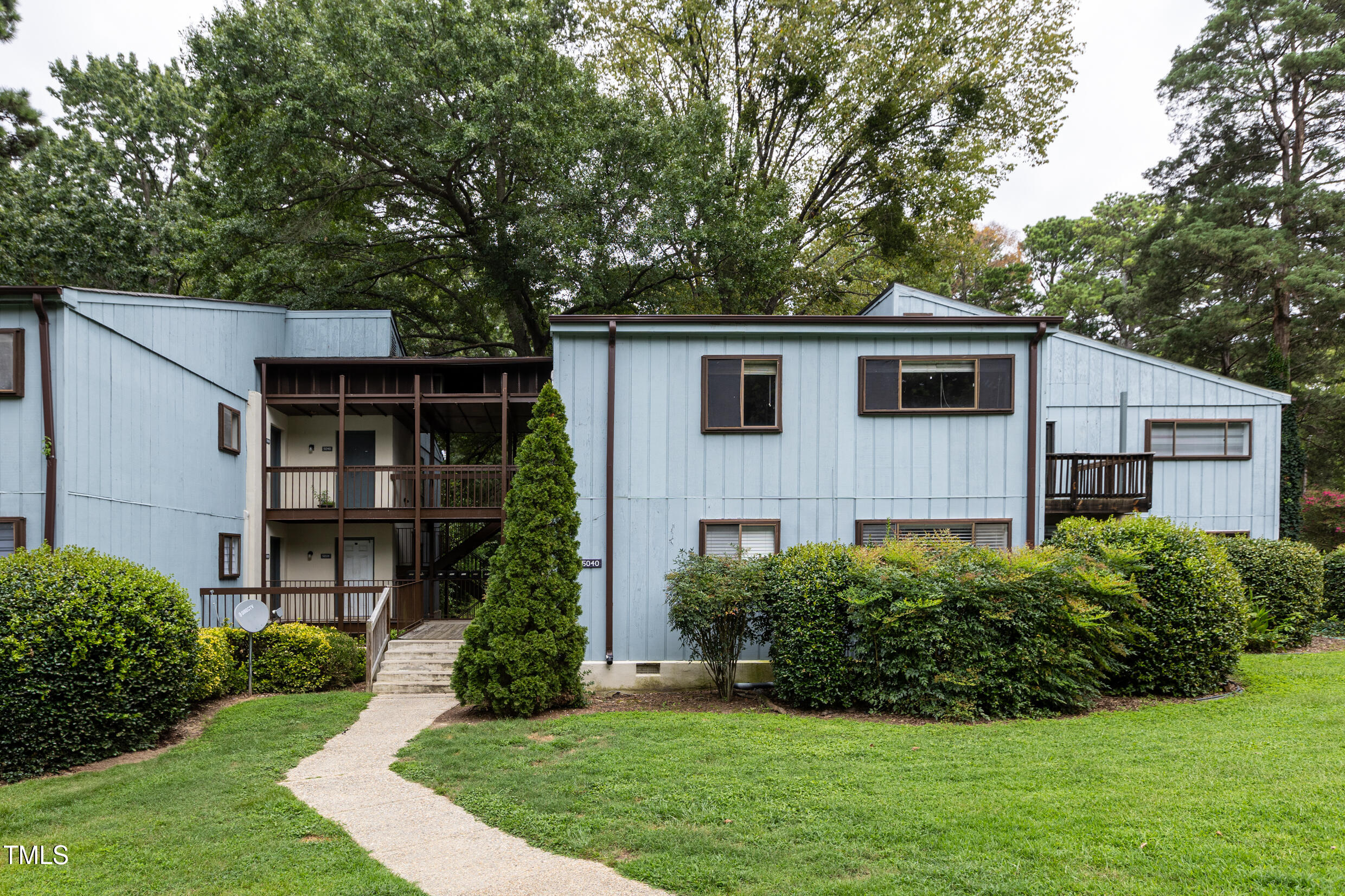5036 Flint Ridge Place Raleigh, NC 27609 - Photo 1 of 21 a front view of a house with a yard