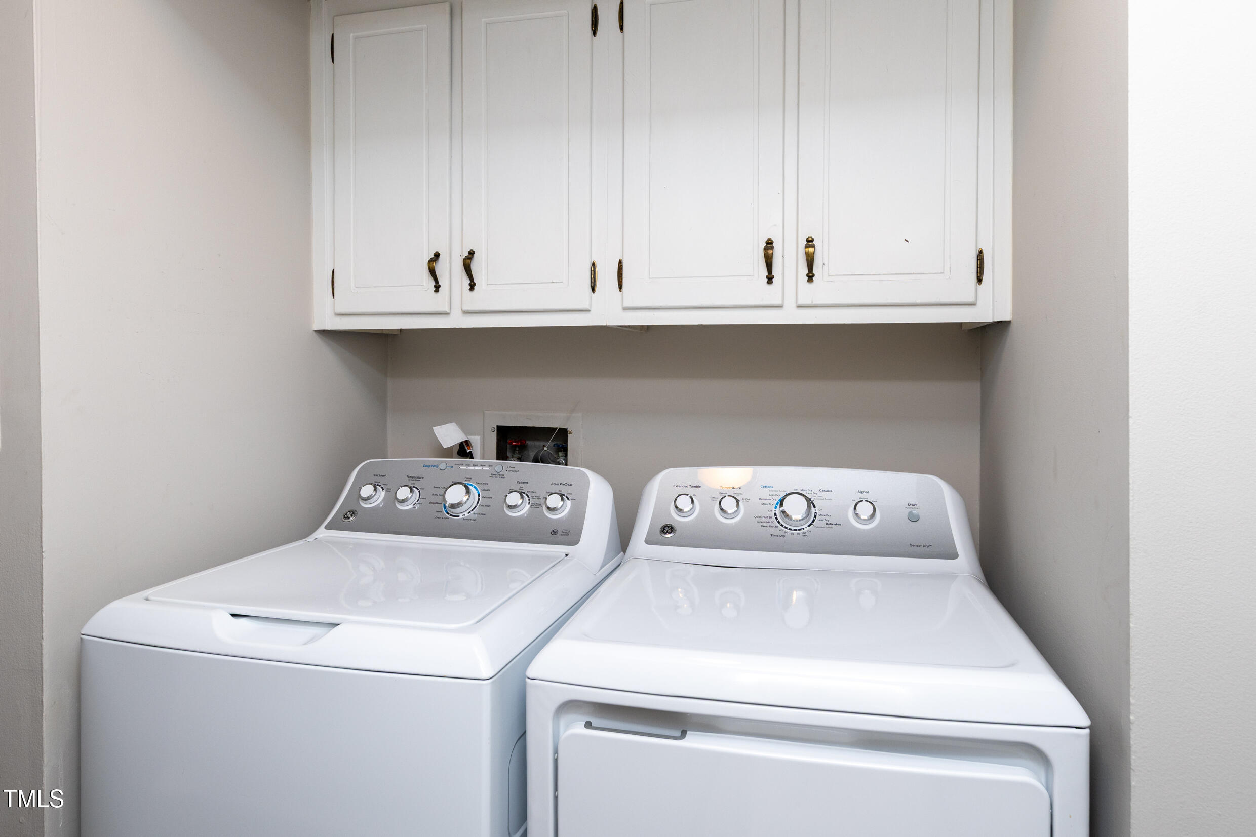 5036 Flint Ridge Place Raleigh, NC 27609 - Photo 13 of 21 a utility room with dryer and washer