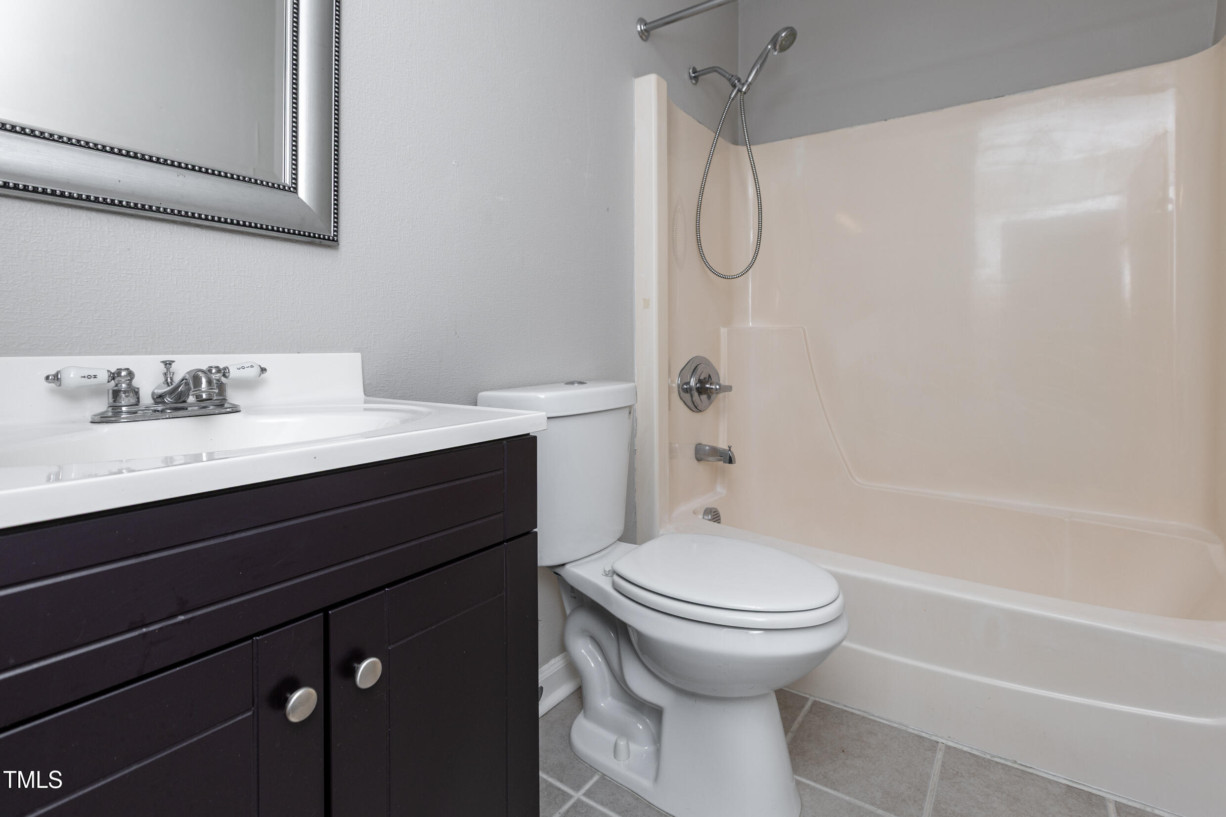 5036 Flint Ridge Place Raleigh, NC 27609 - Photo 20 of 21 a bathroom with a sink a toilet and a bathtub