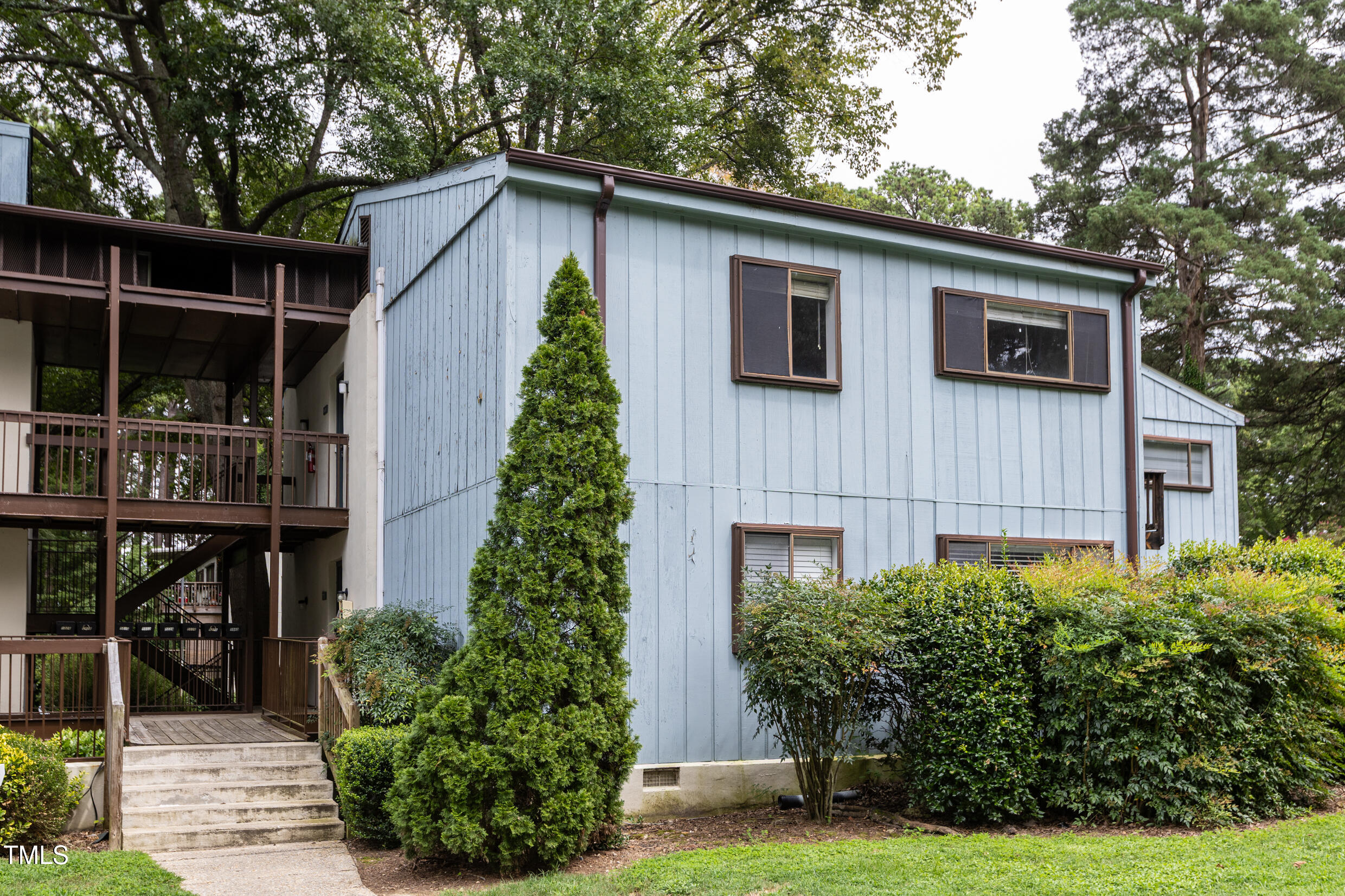5036 Flint Ridge Place Raleigh, NC 27609 - Photo 2 of 21 a front view of a house with garden