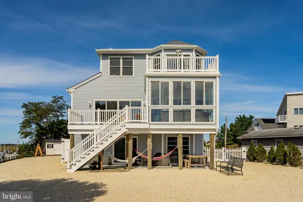 an aerial view of a house with a ocean view