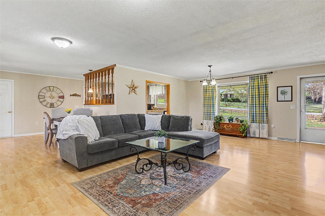 305 Clearview Drive Anderson, SC 29625 - Photo 4 of 35 Bright and inviting living space with ample natural light, perfect for gatherings and relaxation.