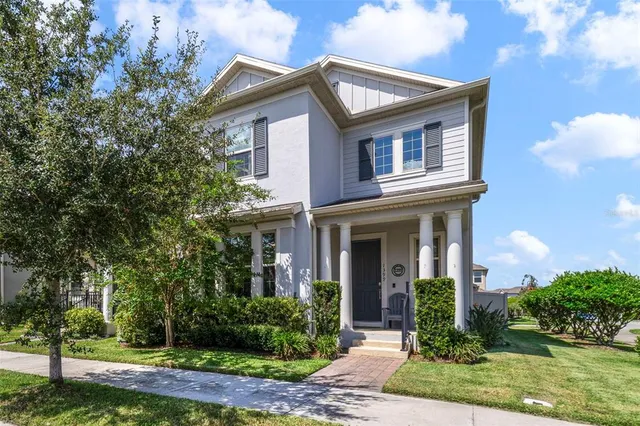 a front view of a house with garden