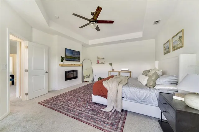 a bedroom with furniture and a fireplace